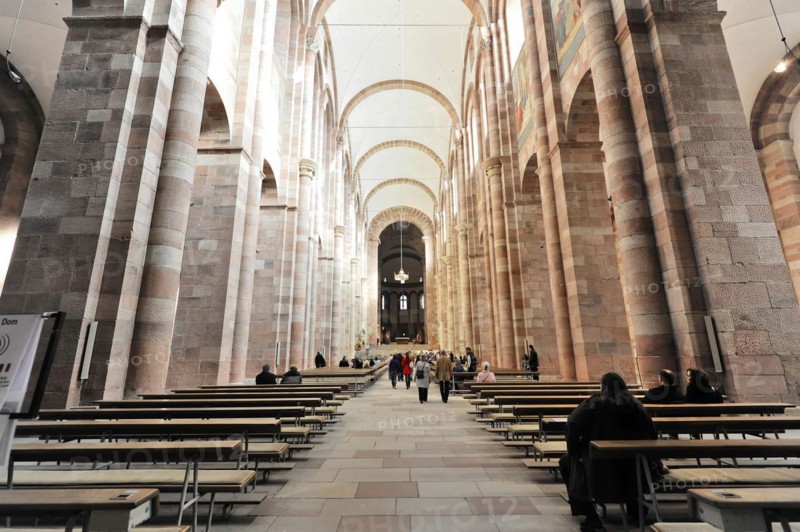 Speyer Cathedral, majestic church interior with people walking between columns and stained glass windows, Speyer Cathedral, Unesco World Heritage Site, foundation stone laid around 1030, Speyer, Rhineland-Palatinate, Germany, Europe