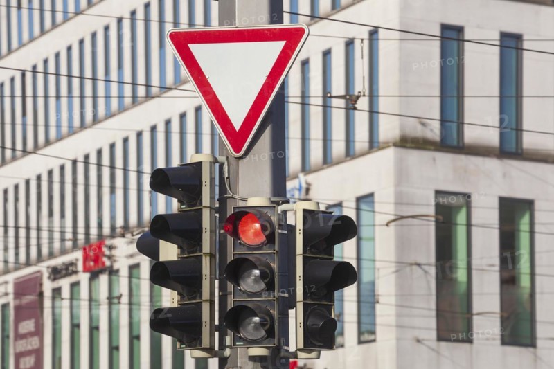 Traffic lights switched to red and traffic sign giving way, Germany, Europe