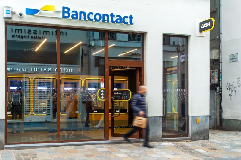 Indoor ATM cash dispenser of bank neutral Bancontact CASH point in shopping street in the city centre of Ghent, Gent, East Flanders, Belgium, Europe