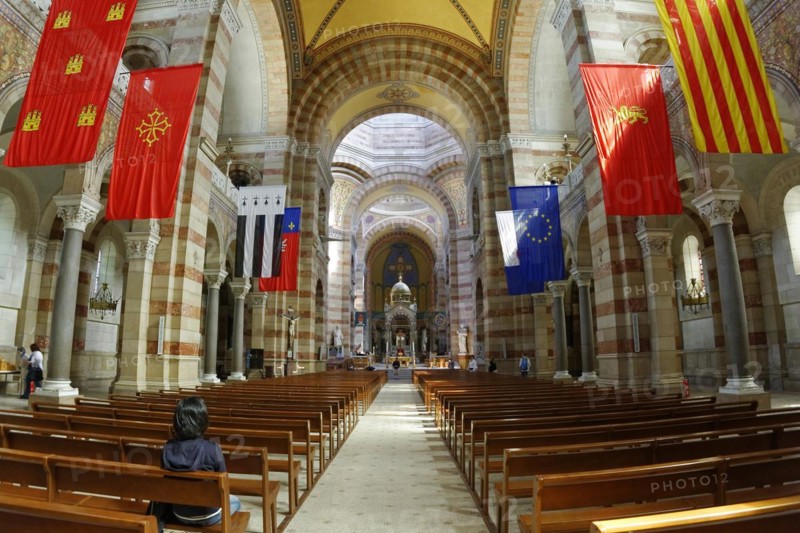Marseille Cathedral or Cathedrale Sainte-Marie-Majeure de Marseille, 1852-1896, Marseille, Interior view of a church with flags and symmetrical architecture with natural light, Marseille, Departement Bouches-du-Rhone, Region Provence-Alpes-Cote d'Azur, France, Europe