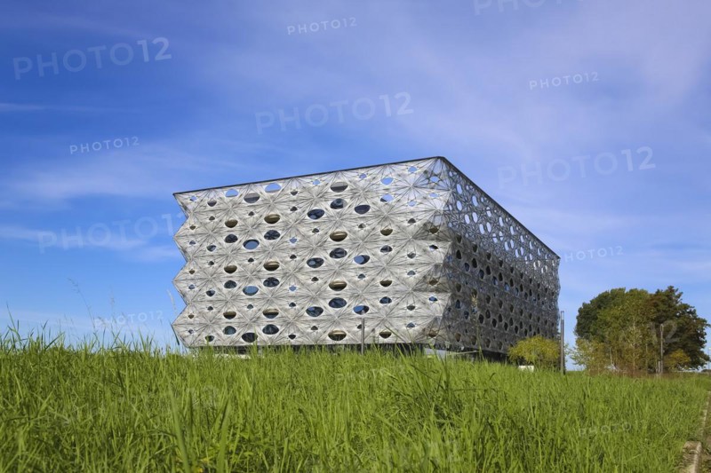 Reutlingen University, Reutlingen University, Texoversum, German University Building Award 2024 for TEXOVERSUM, modern architecture, facade made of carbon and glass fibres, mesh, innovative, identity-creating, unique facade, campus, place of learning, special, extraordinary new building for textile courses, light, airy, airy, holes, architectural eye-catcher, green meadow, university campus, Reutlingen, Baden-Wuerttemberg, Germany, Europe