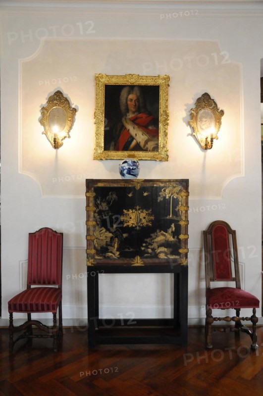 Langenburg Castle, Classic interior with portrait painting and candlesticks on the wall and two red chairs, Langenburg Castle, Langenburg, Baden-Wuerttemberg, Germany, Europe