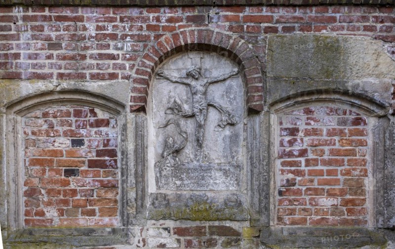 Stone relief of the crucified Christ at St Mary's Cathedral, Havelberg, Saxony-Anhalt, Germany, Europe