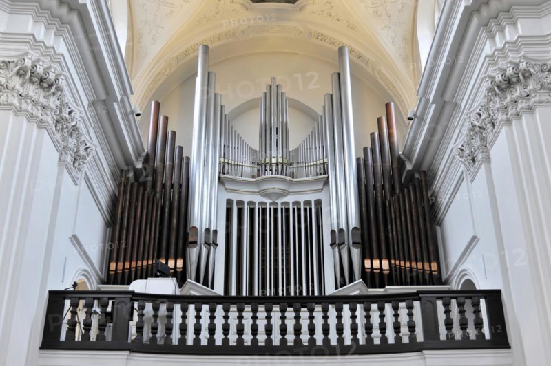 The organ in the Neumuenster collegiate monastery, Wuerzburg, close-up of an organ with many pipes and ornamental wooden railings on a balcony, Wuerzburg, Lower Franconia, Bavaria, Germany, Europe