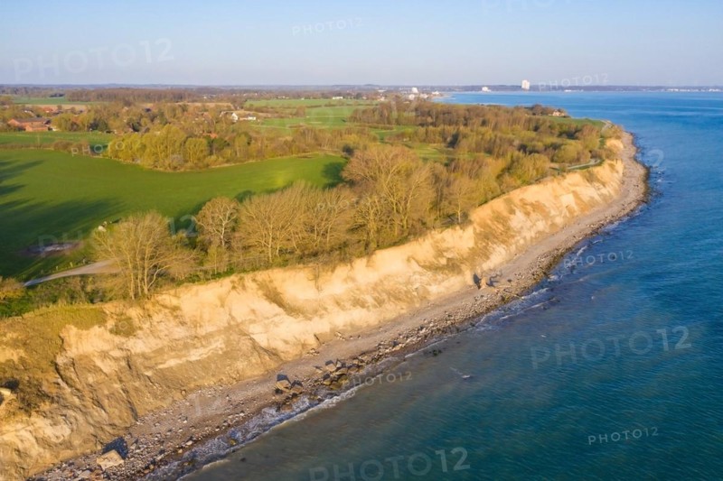 Aerial view over beach and Brodtener Ufer, Brodten Steilufer, cliff in the Bay of Luebeck along the Baltic Sea at sunrise, Schleswig-Holstein, Germany, Europe