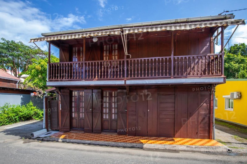 Deshaies, historic Caribbean wooden building of a street in Guadeloupe, Caribbean, French Antilles