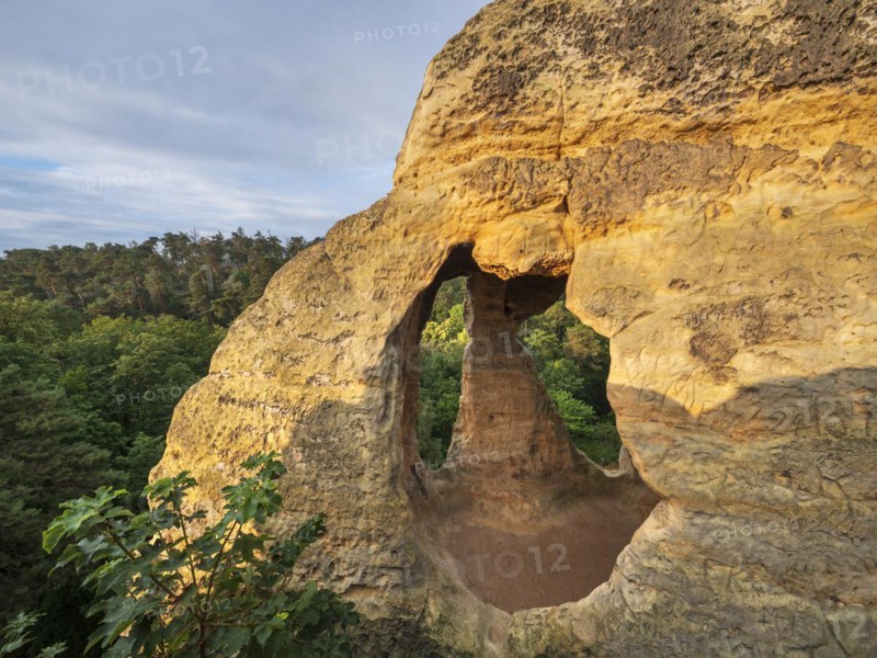 Cave at Klusfelsen in the Klusberge mountains, prehistoric place of worship, later Christian hermitage and cave dwelling, Kluskapelle, sandstone rock with natural and artificial caves in the Harz Mountains, Halberstadt, Saxony-Anhalt, Germany, Europe