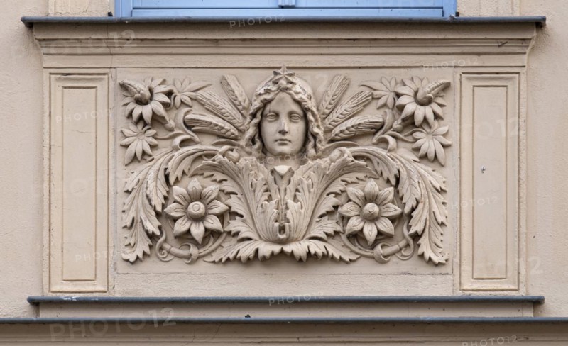 Relief with a woman's face on a house wall, Havelberg, Saxony-Anhalt, Germany, Europe