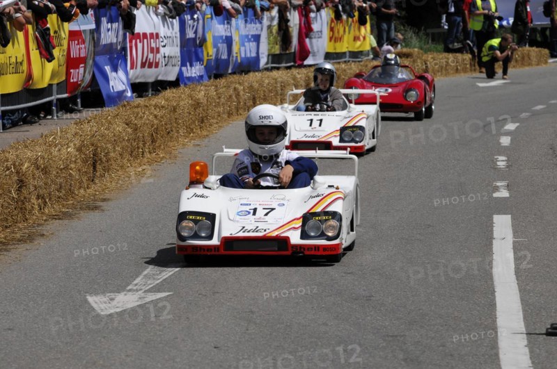 Two people in white racing suits steer their soapboxes during a race, SOLITUDE REVIVAL 2011, Stuttgart, Baden-Wuerttemberg, Germany, Europe