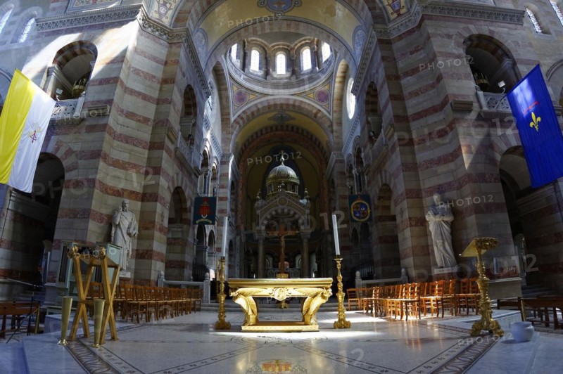 Marseille Cathedral or Cathedrale Sainte-Marie-Majeure de Marseille, 1852-1896, Marseille, Interior view of a church with a view of the altar and stained glass windows above pews, Marseille, Departement Bouches-du-Rhone, Region Provence-Alpes-Cote d'Azur, France, Europe