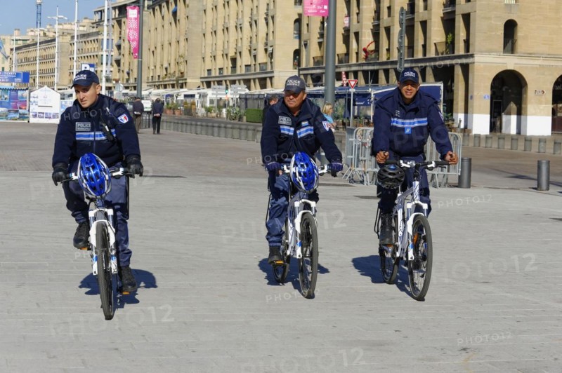 Three police officers on bicycles patrolling a city street, Marseille, Bouches-du-Rhone department, Provence-Alpes-Cote d'Azur region, France, Europe
