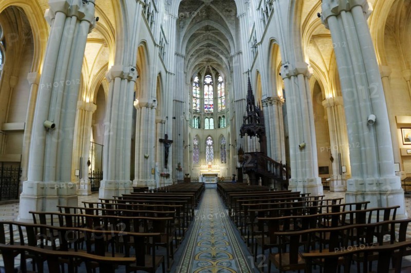 Church of Saint-Vincent-de-Paul, interior view of a church with rows of columns, pews and light falling on the altar, Marseille, Departement Bouches-du-Rhone, Provence-Alpes-Cote d'Azur region, France, Europe