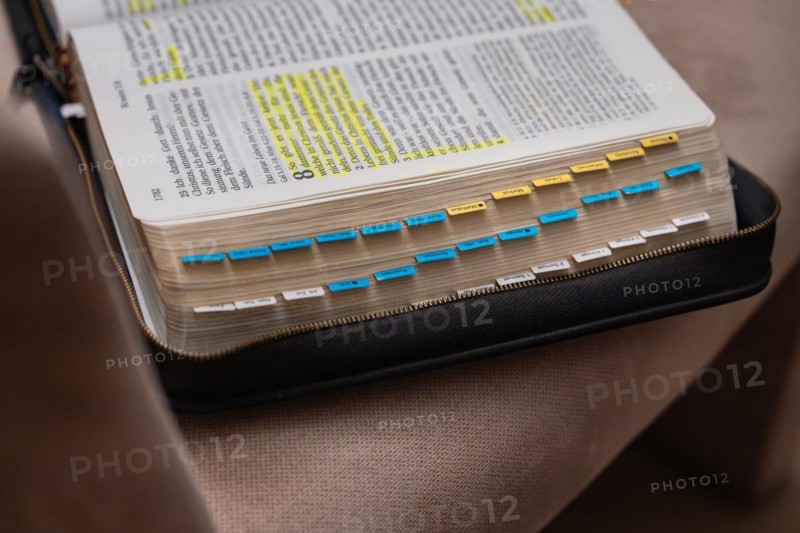 Open Bible with yellow and blue bookmark on a black book cover, Bibelkreis, Jesus Grace Chruch, Ludwigsburg, Germany, Europe