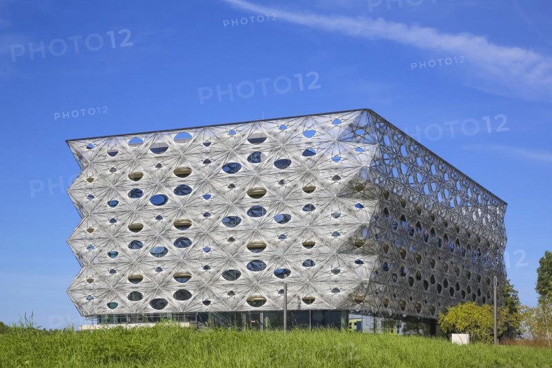 Reutlingen University, Reutlingen University, Texoversum, German University Building Award 2024 for TEXOVERSUM, modern architecture, facade made of carbon and glass fibres, mesh, innovative, identity-creating, unique facade, campus, place of learning, special, extraordinary new building for textile courses, light, airy, airy, holes, architectural eye-catcher, green meadow, university campus, Reutlingen, Baden-Wuerttemberg, Germany, Europe
