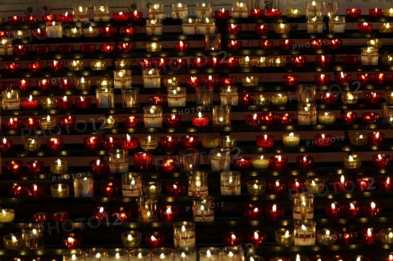 Church of Notre-Dame de la Garde with mosaics, Marseille, Many lit candles arranged in rows create a devotional atmosphere, Marseille, Departement Bouches-du-Rhone, Region Provence-Alpes-Cote d'Azur, France, Europe