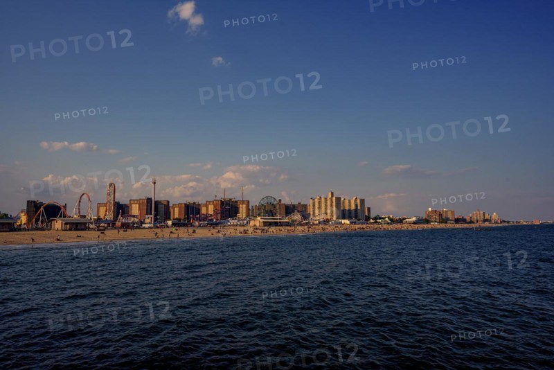 Sun sets on a warm summer day in Coney Island, Brooklyn, NY, USA, USA, North America