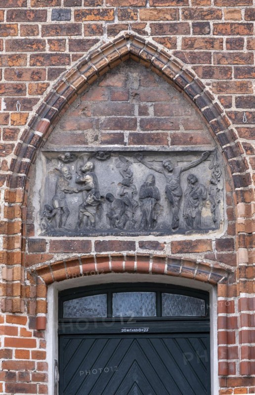 Relief with crucified Christ above a door of the parish church of St Laurentius, Havelberg, Saxony-Anhalt, Germany, Europe