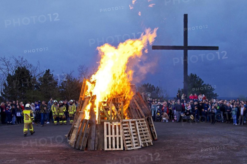 The fire brigade has lit the Easter bonfire on the Haniel spoil tip in front of the summit cross, Bottrop, Ruhr area, North Rhine-Westphalia, Germany, Europe