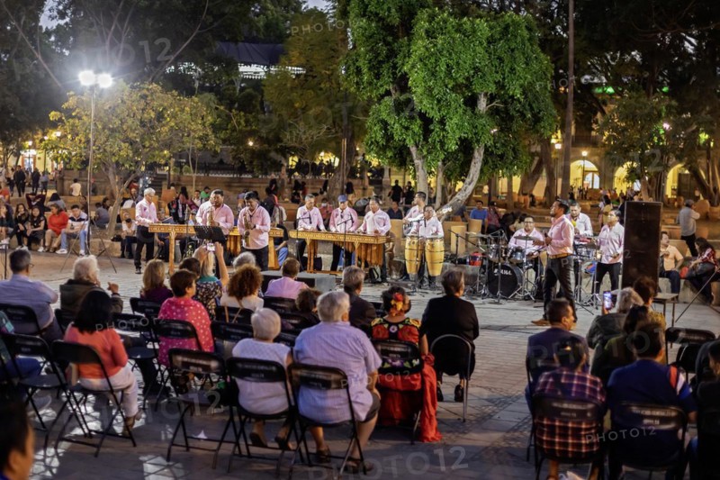Oaxaca, Mexico, The Marimba del Estado band entertains a crowd in the zocalo. Marimba band music is traditional in southern Mexico, Central America