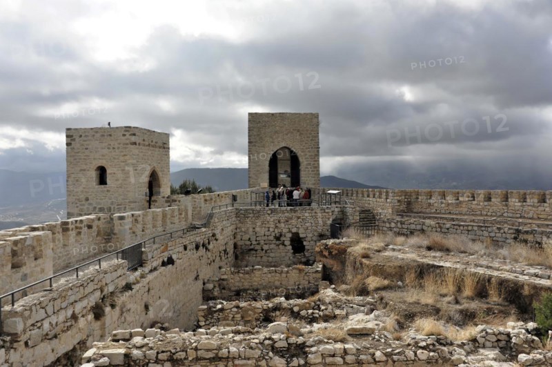 Castillo de Santa Catalina on Jaen, Historic fortress with towers and visitors on the ruins with cloudy sky in the background, Granada, Andalusia, Spain, Europe