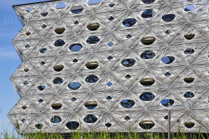 Reutlingen University, Reutlingen University, Texoversum, German University Building Award 2024 for TEXOVERSUM, modern architecture, facade made of carbon and glass fibres, mesh, innovative, identity-creating, unique facade, campus, place of learning, special, extraordinary new building for textile courses, light, airy, airy, holes, architectural eye-catcher, Reutlingen, Baden-Wuerttemberg, Germany, Europe