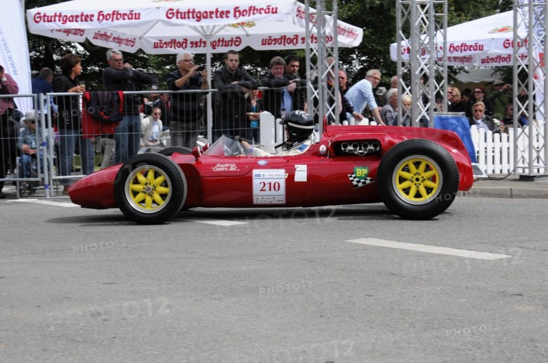 A red vintage racing car with sunshine and a driver in a yellow helmet, SOLITUDE REVIVAL 2011, Stuttgart, Baden-Wuerttemberg, Germany, Europe