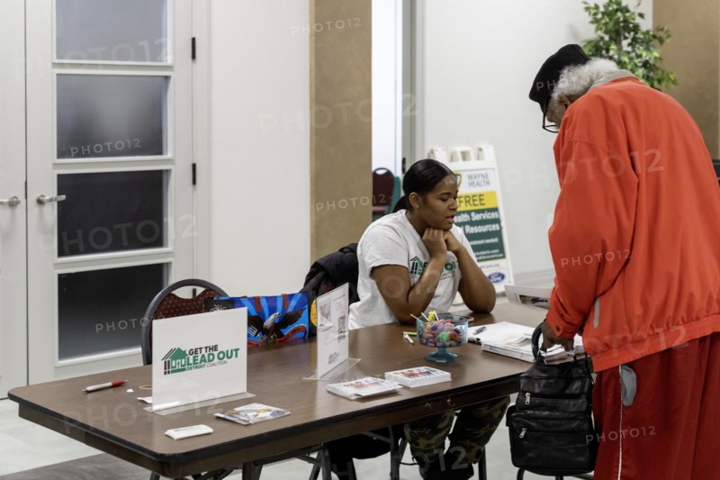Detroit, Michigan, A woman explains the city's plan to replace all lead water service lines at a community health fair