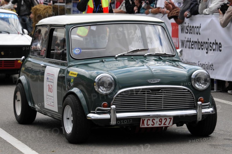 A green classic Mini with a racing number drives past spectators at a car race, SOLITUDE REVIVAL 2011, Stuttgart, Baden-Wuerttemberg, Germany, Europe