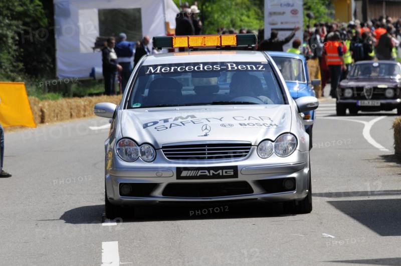 The white Mercedes-AMG safety vehicle on a race track surrounded by spectators, SOLITUDE REVIVAL 2011, Stuttgart, Baden-Wuerttemberg, Germany, Europe