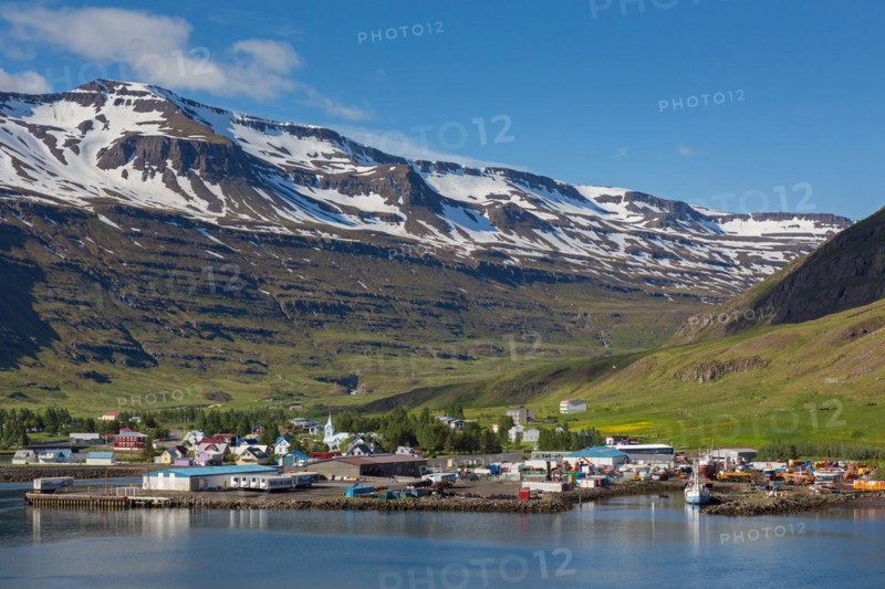 View over harbour and town Seyoisfjoerour along the fjord Seydisfjoerdur in summer, Eastern Region, Austurland, Iceland, Europe