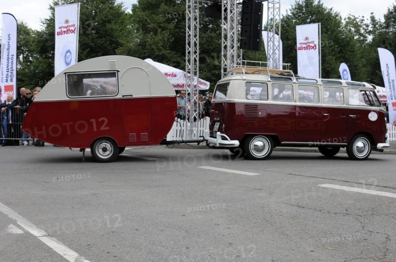 Side view of a VW bus with caravan in front of a crowd of spectators, SOLITUDE REVIVAL 2011, Stuttgart, Baden-Wuerttemberg, Germany, Europe