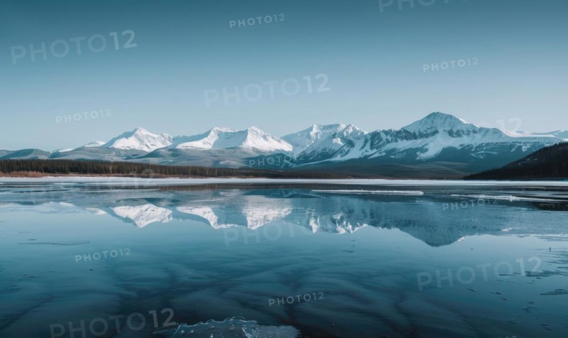 A distant view of snow-capped mountains reflected in the frozen surface of a lake AI generated