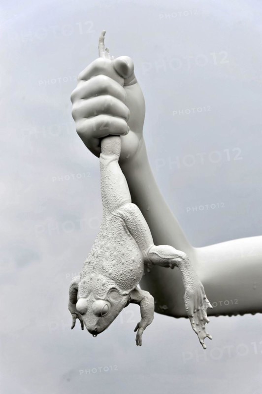 Charles Ray's statue of the boy with a frog on the top of the Zattere, detail of a surrealist sculpture with a white hand holding a frog, Venice, Veneto, Italy, Europe