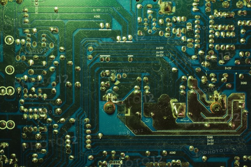 Close-up of green lighted electronic computer circuit board with silver solder points and lines, Studio Composition, Quebec, Canada, North America
