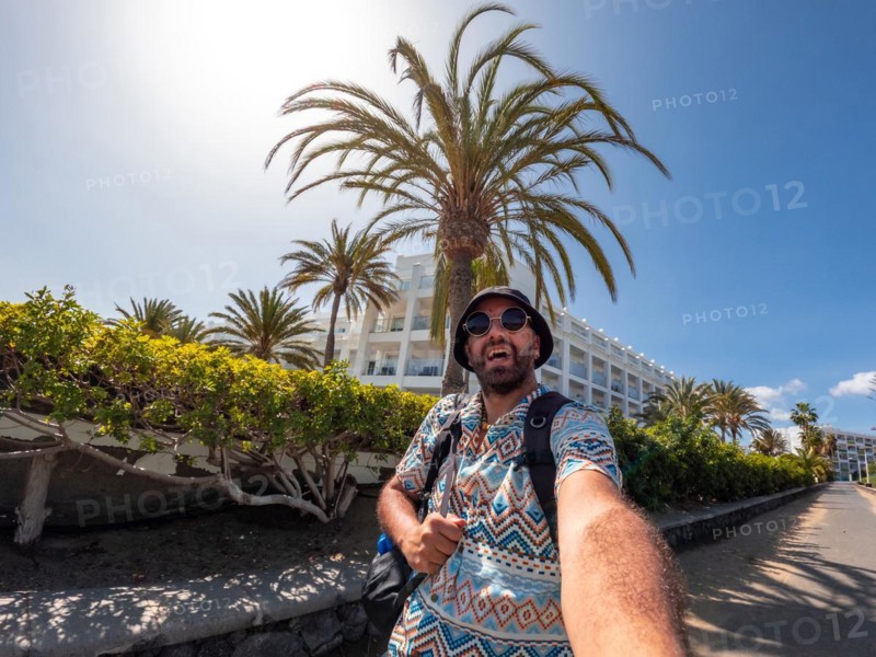 Selfie of tourist man in summer in the dunes of Maspalomas, Gran Canaria, Canary Islands