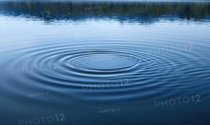 A gentle breeze causing ripples on the surface of a spring lake AI generated