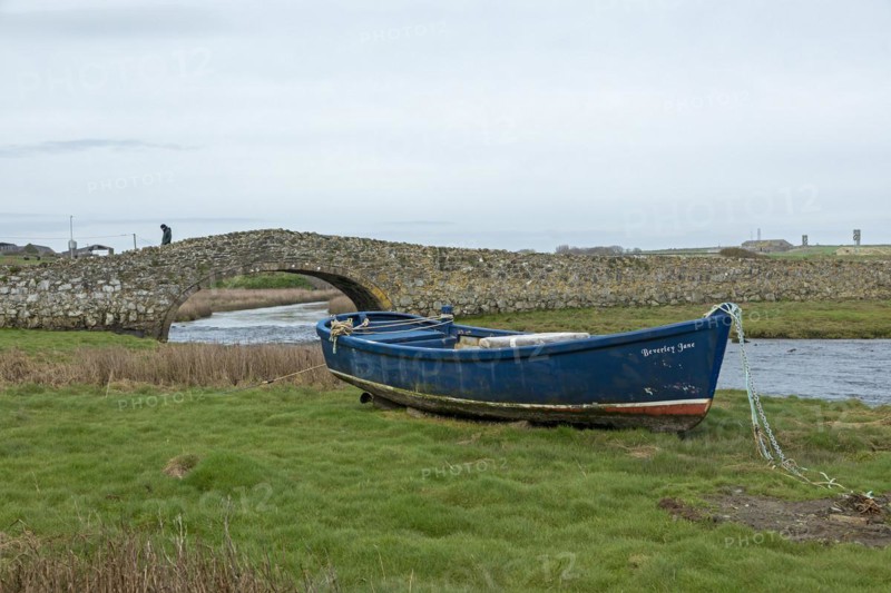 Stone bridge, fishing boat, man, Aberffraw, Isle of Anglesey, Wales, Great Britain