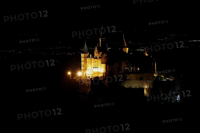 Hohenzollern Castle, ancestral castle of the princely family and former ruling Prussian royal and German imperial house of Hohenzollern, summit castle, historical building by the Berlin architect Friedrich August Stueler, architecture, neo-Gothic, castle building, aristocratic residence, south view from the Zellerhorn, night view, illumination, artificial light, Bisingen, Zollernalbkreis, Baden-Wuerttemberg, Germany, Europe