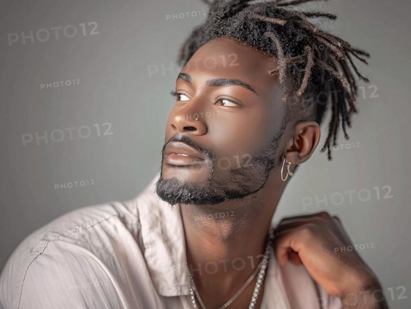 Close-up portrait of a man with dreads and beard, wearing a cream shirt and jewelry, AI generated