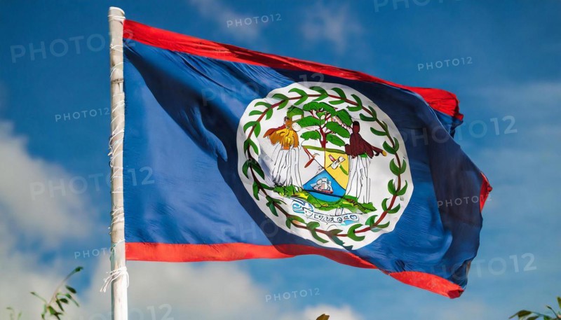 Flags, the national flag of Belize flutters in the wind