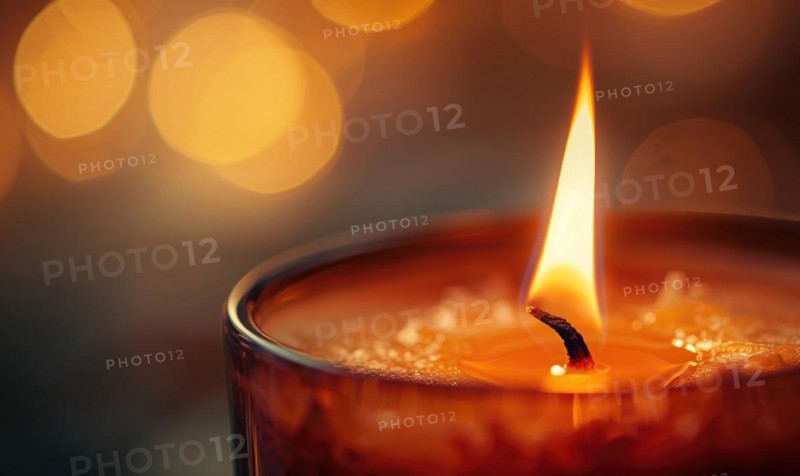 Close-up of a flickering candle flame casting a warm glow AI generated