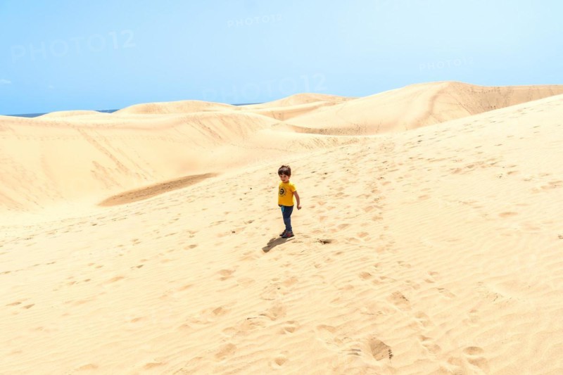 Little boy enjoying in the dunes of Maspalomas, Gran Canaria, Canary Islands