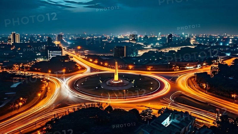 Circular trails of light from car headlights tracing movement around a city monument, AI generated