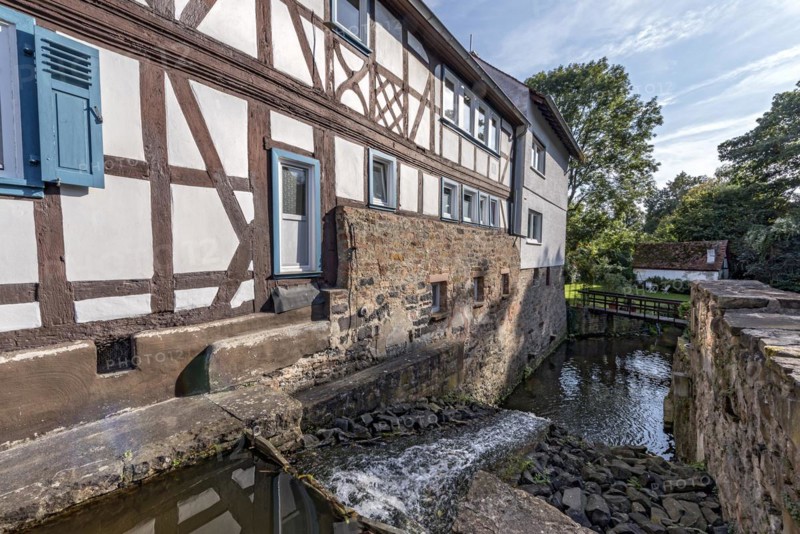 Former mill on the Muehlgraben, historic half-timbered house from around 1709, cultural monument, listed building, old town, Ortenberg, Vogelsberg, Wetterau, Hesse, Germany, Europe