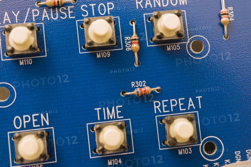 Close-up of blue electronic DVD player circuit board with function push button controls, Studio Composition, Quebec, Canada, North America