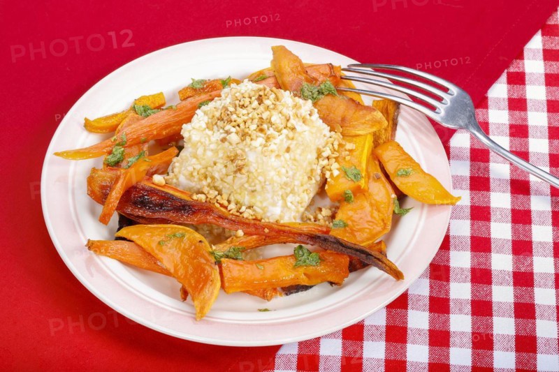 South German cuisine, butternut squash, butternut squash, baked squash with goat's cheese, cheese in a nut crust, nut coating, vegetables cut on a plate, fork, oven vegetables, pumpkin, fruit vegetables, fruit, carrots, celery, healthy cooking, vegetarian, autumn cuisine, pumpkin dishes, food, studio, Germany, Europe