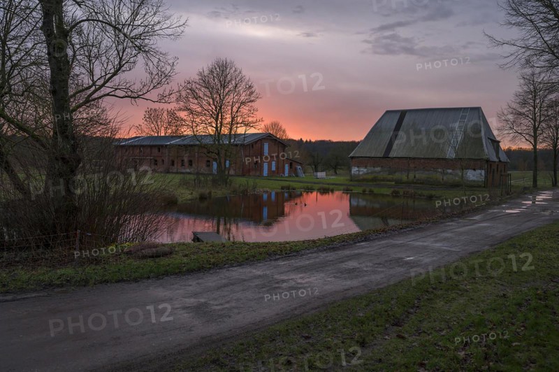 Evening atmosphere with stables and fire pond on an old farm from 1921, Othenstiorf, Mecklenburg-Vorpommern, Germany, Europe