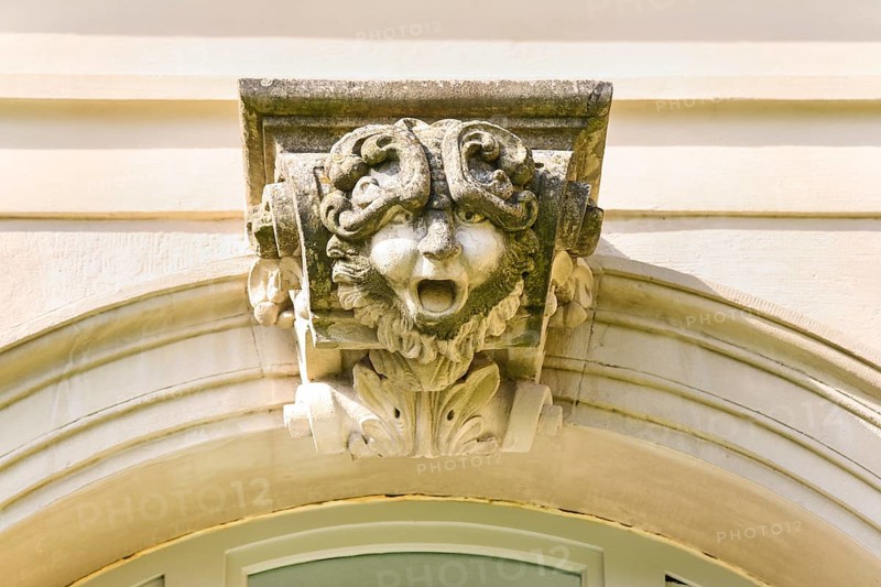 Mythical creature above archway, stone figure, face, Winnental Castle built in the 15th century by the Teutonic Knights as the seat of the Winnenden Commandery, former castle of the Teutonic Order, today Winnenden Castle Clinic Centre for Psychiatry, castle building, historical building, architecture, Winnenden, Rems-Murr-Kreis, Baden-Wuerttemberg, Germany, Europe