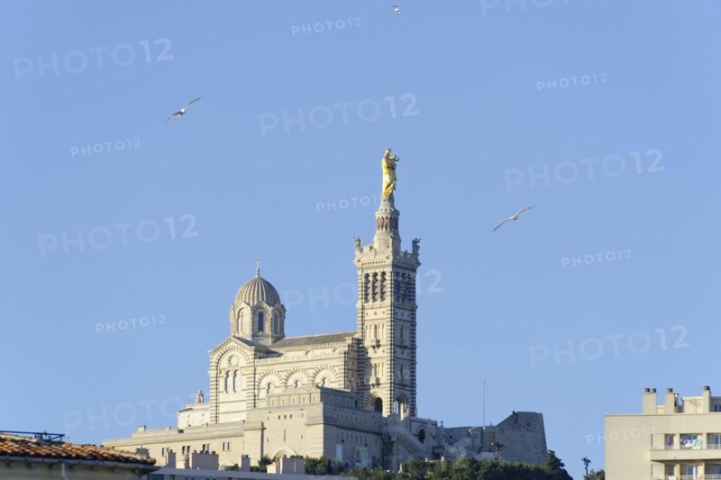 Church of Notre-Dame de la Garde, distant view of the Basilica of Notre-Dame de la Garde in Marseille on a hill under a blue sky, Marseille, Departement Bouches-du-Rhone, Region Provence-Alpes-Cote d'Azur, France, Europe