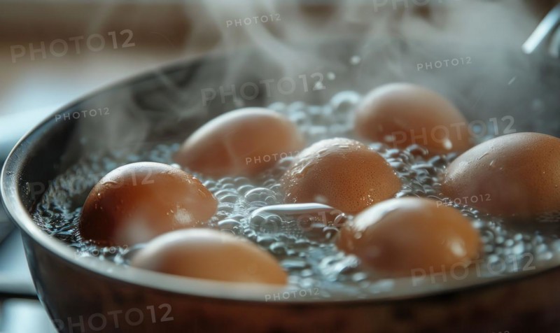 Eggs boiling in a pot of water, closeup view AI generated